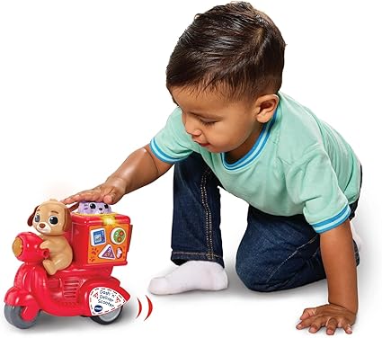 VTech Dash 'n' Deliver Scooter, Teaches Colours, Animals, Numbers, Songs & Melodies, Interactive Buttons for Role-Play Fun, Gift for Ages 12, 18, 24 Months+, English Version - Adenzo Comfies