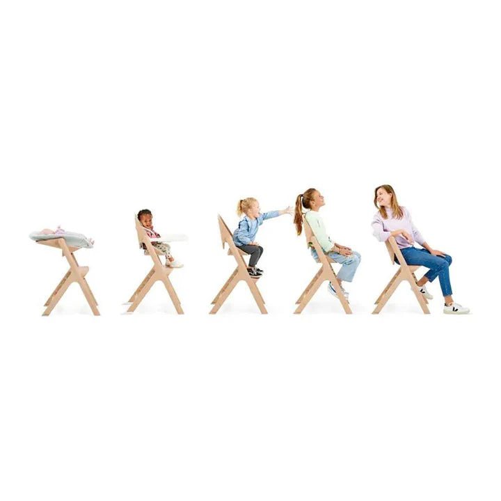 Maxi - Cosi Nesta Highchair in its natural wood finish, a stylish, adjustable wooden highchair designed to grow with a child from newborn to adult - Adenzo Comfies