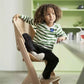 Maxi - Cosi Nesta Highchair in its natural wood finish, a stylish, adjustable wooden highchair designed to grow with a child from newborn to adult - Adenzo Comfies