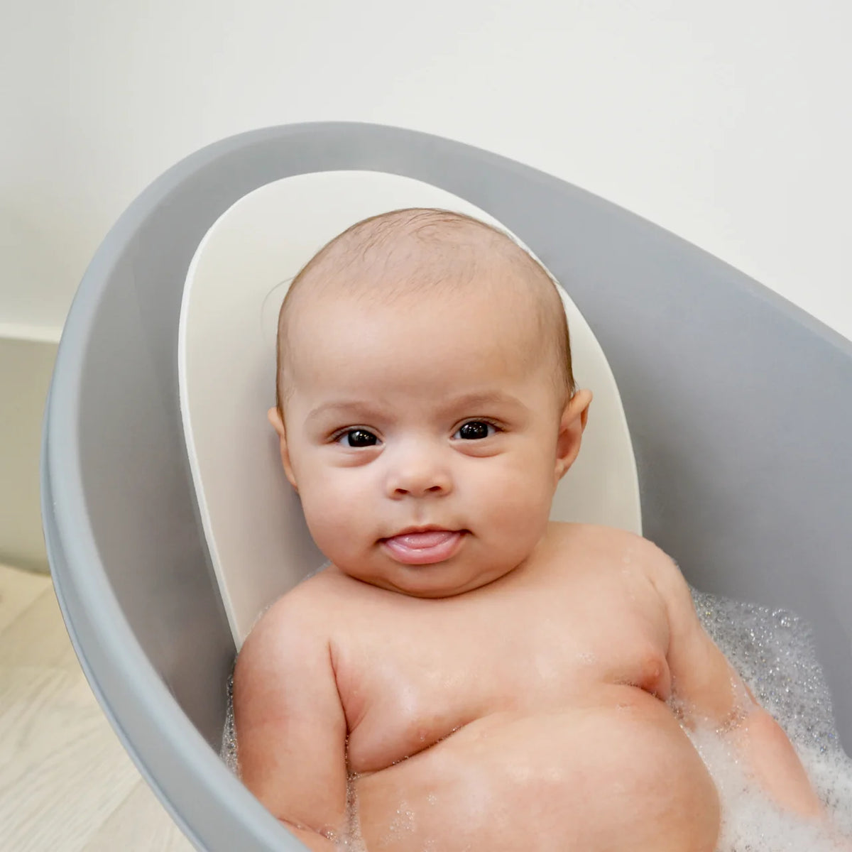 Shnuggle Baby Bath Tub Featuring Ergonomic Bum Bump Support, Soft Foam Backrest and an Integrated Plug-Grey.